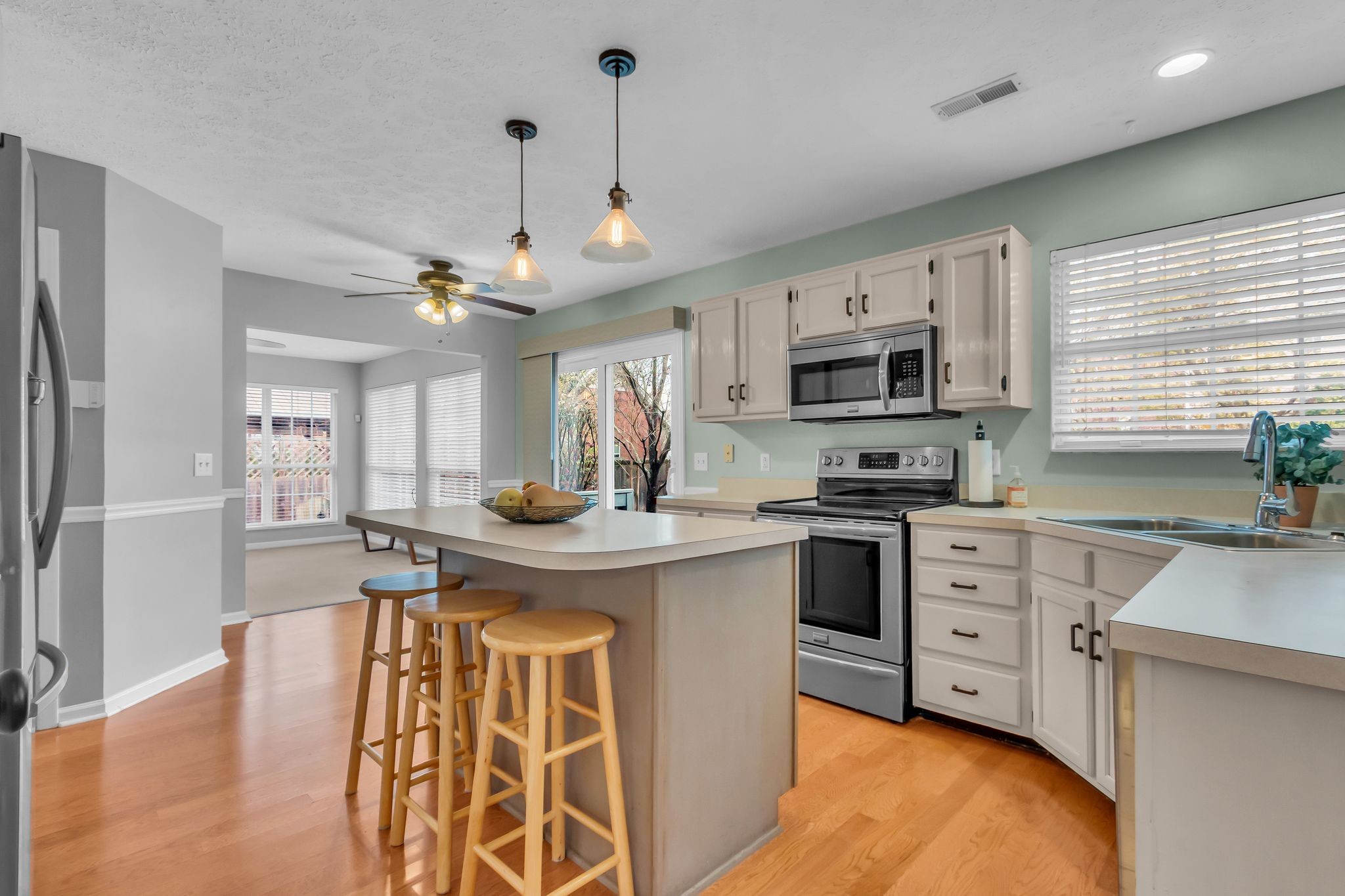 505 Hollyhock Way Franklin, TN 37064 - Photo 7 of 28 a kitchen with stainless steel appliances granite countertop a sink stove and refrigerator