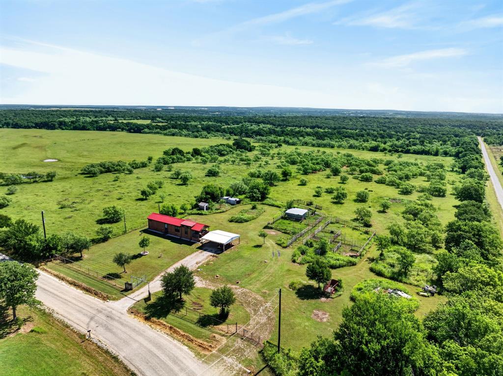 2401 Lamkin Road Mineral Wells, TX 76067 - Photo 34 of 36 a view of a green field with lots of green space