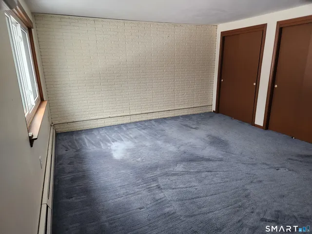 a view of a glass door with a tree