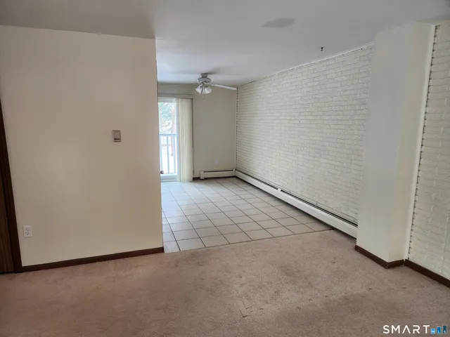 a kitchen with a stove top oven and cabinets