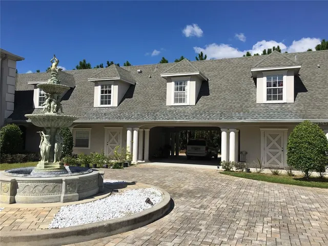 a view of a white building with many windows