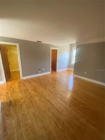 a view of a big room with wooden floor
