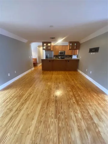 a view of a kitchen with kitchen island and a wooden floor
