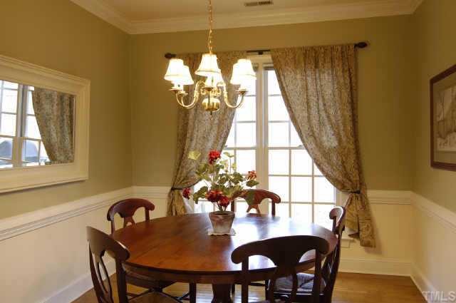 5017 Denham Court Raleigh, NC 27613 - Photo 3 of 11 a view of a dining room with furniture and chandelier
