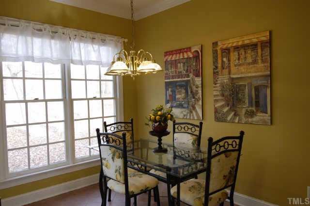 5017 Denham Court Raleigh, NC 27613 - Photo 5 of 11 a view of a dining room with furniture and chandelier