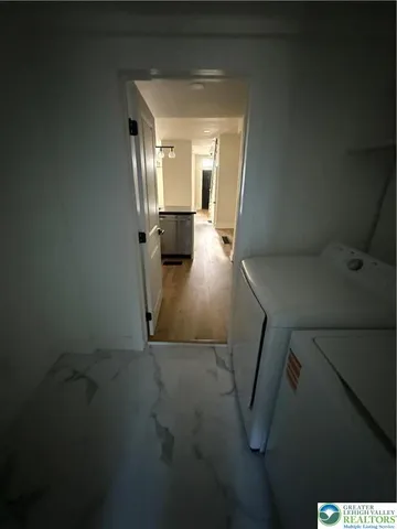 a view of staircase with white walls