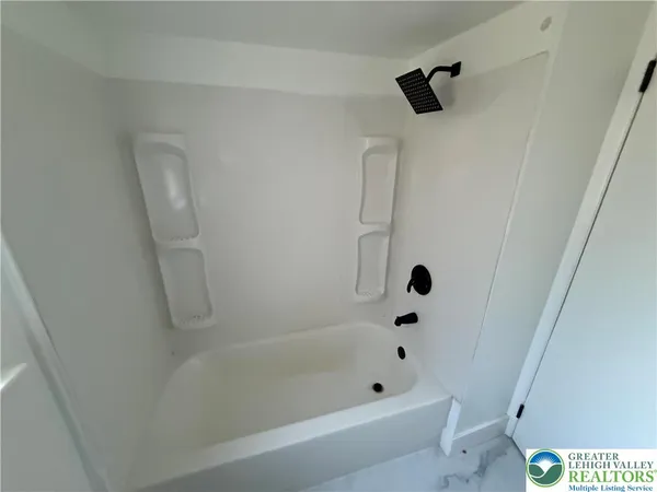 a bathroom with a bathtub