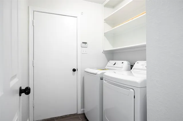 a utility room with dryer and washer