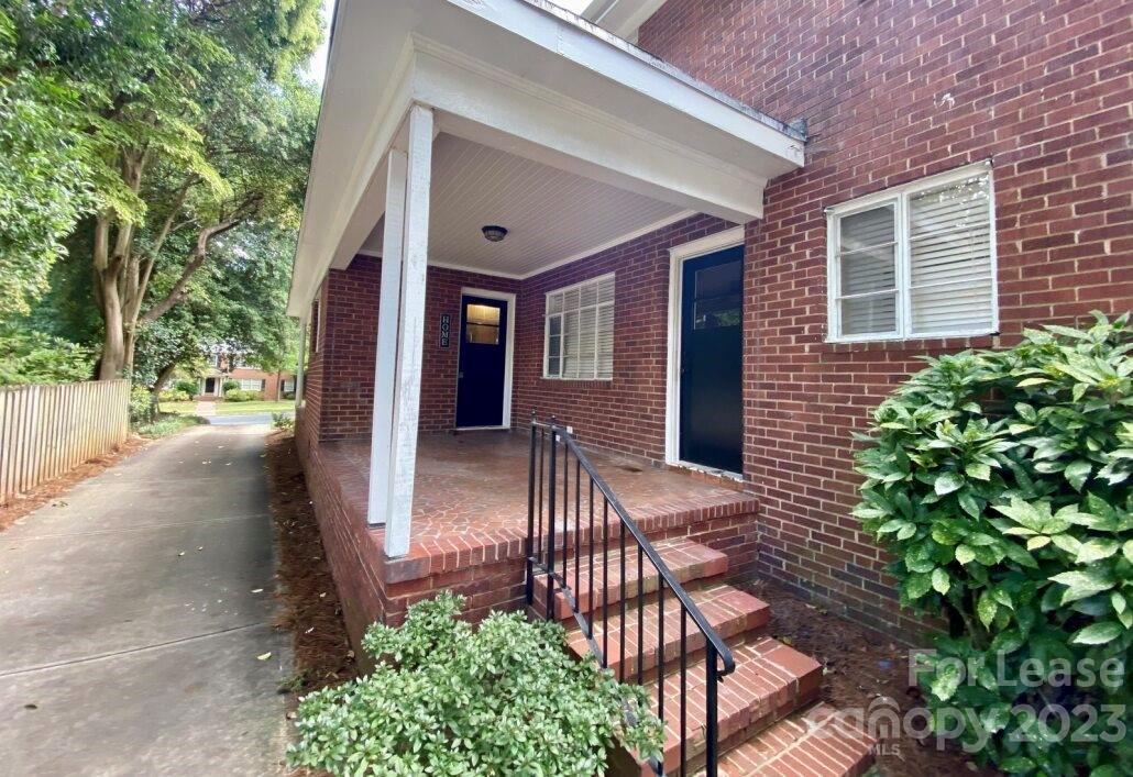 1708 Dilworth Road West, Unit 9 Charlotte, NC 28203 - Photo 2 of 14 a view of a porch with chairs and potted plants