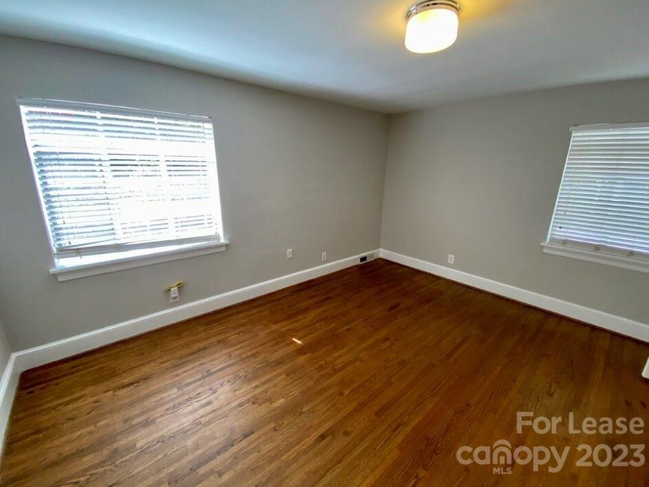 1708 Dilworth Road West, Unit 9 Charlotte, NC 28203 - Photo 7 of 14 a view of a room with wooden floor and windows