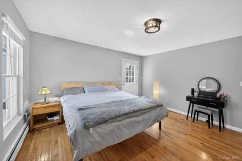 a bedroom with a bed and a table