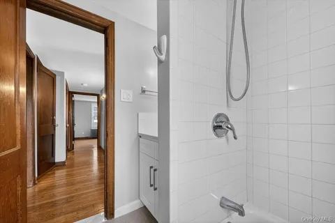 a bathroom with a glass shower door