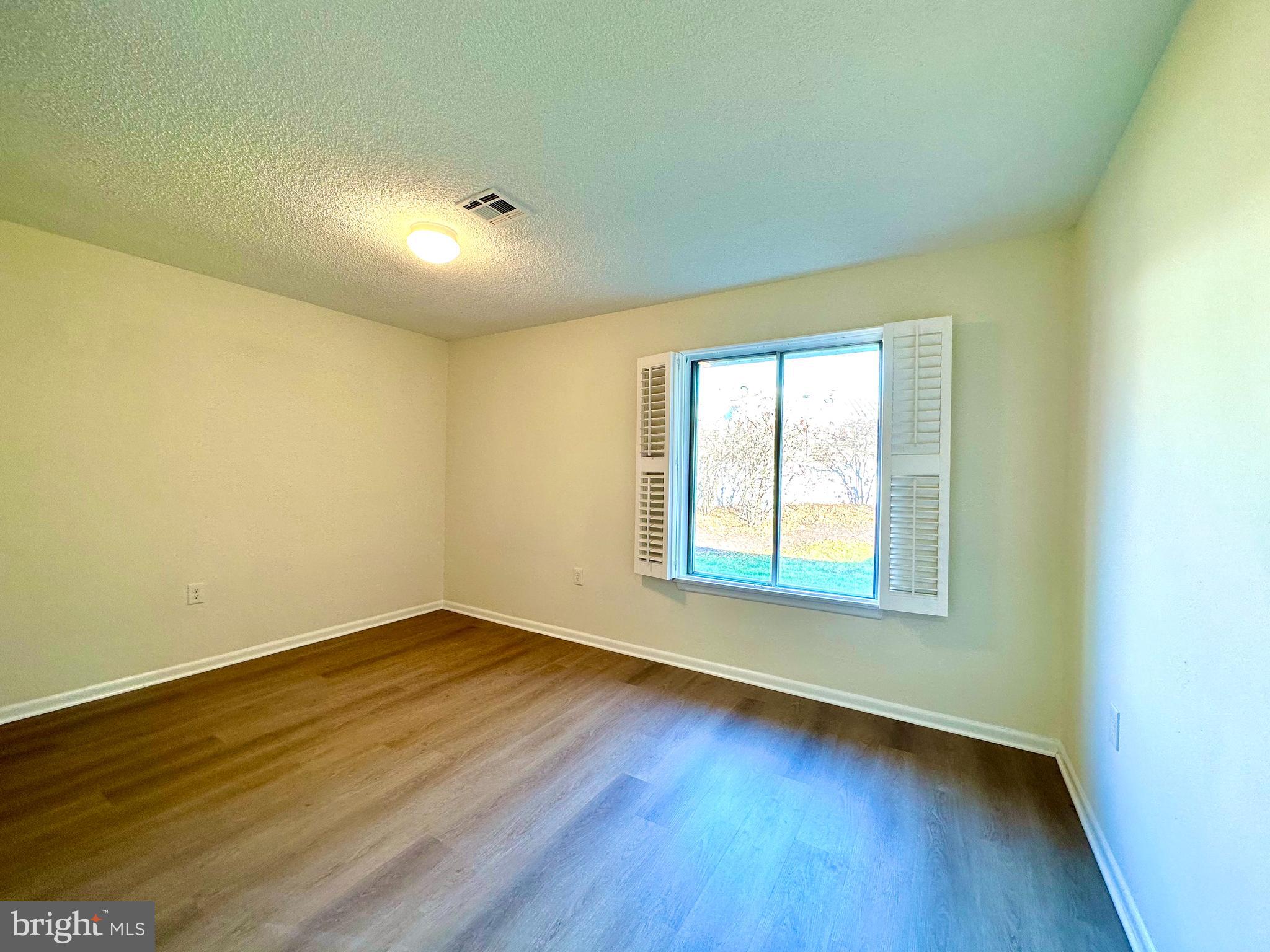 3309 Solomons Court, Unit 102C Silver Spring, MD 20906 - Photo 19 of 36 Second bedroom with new LVT floors