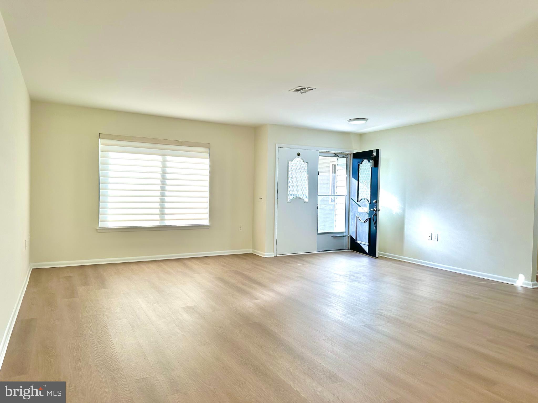 3309 Solomons Court, Unit 102C Silver Spring, MD 20906 - Photo 2 of 36 Living room has Brand New LVT floors