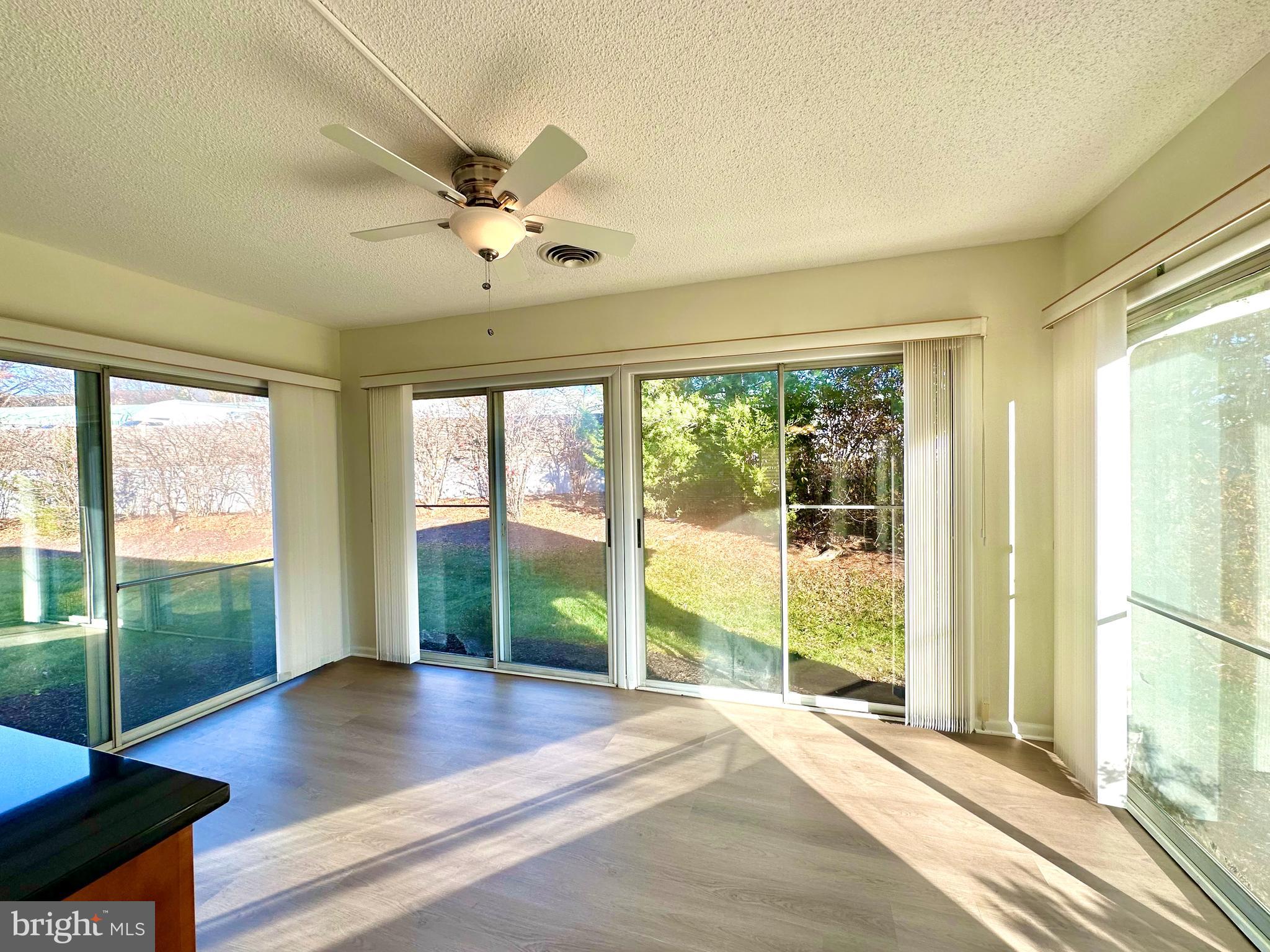 3309 Solomons Court, Unit 102C Silver Spring, MD 20906 - Photo 6 of 36 Sunroom also has new LVT floors
