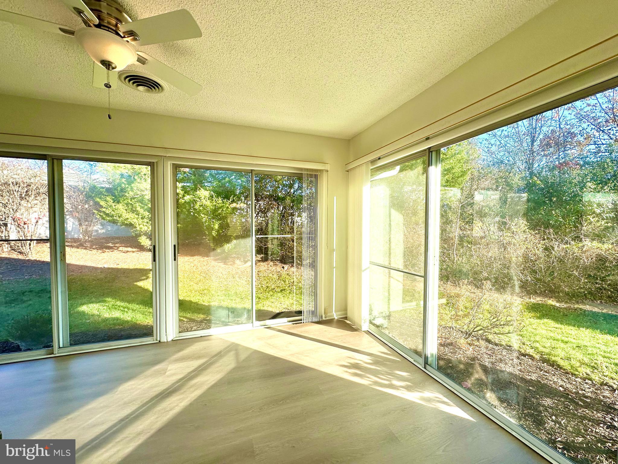 3309 Solomons Court, Unit 102C Silver Spring, MD 20906 - Photo 7 of 36 Sunroom with ceiling fan