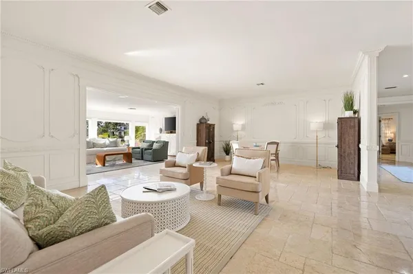 a living room with furniture and a table