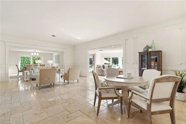 a bedroom with furniture and a flat screen tv
