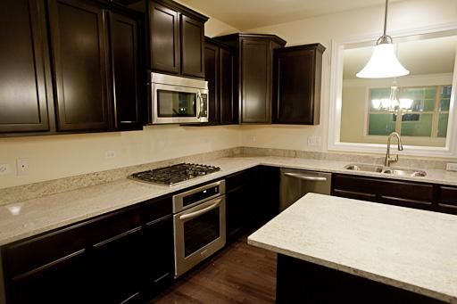 309 South NW Highway, Unit 2 Park Ridge, IL 60068 - Photo 2 of 11 a kitchen with a sink and stainless steel appliances