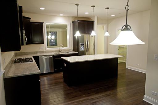 309 South NW Highway, Unit 2 Park Ridge, IL 60068 - Photo 4 of 11 a kitchen with a sink a counter space appliances and cabinets