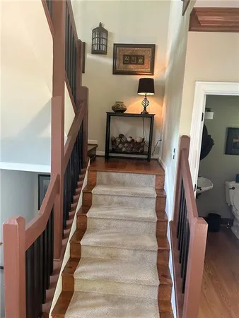 a dining room with furniture window and wooden floor