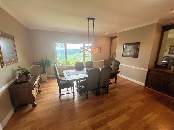 a balcony with furniture and wooden floor