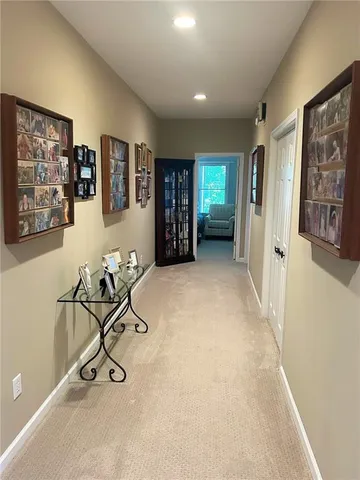 a view of a balcony with wooden floor and fence
