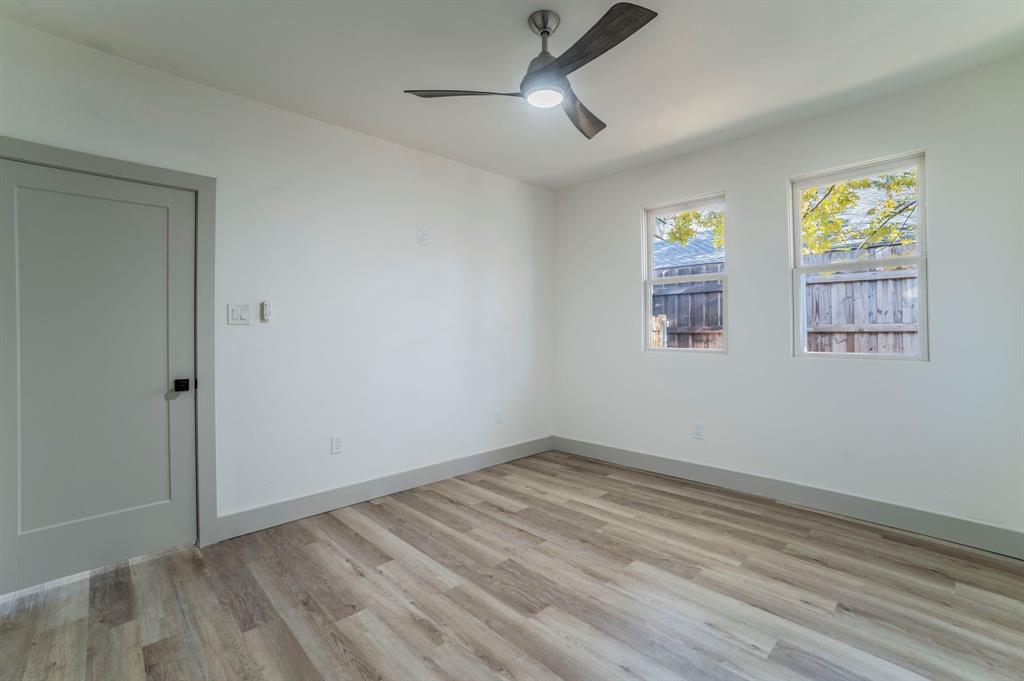 5914 Victor Street Dallas, TX 75214 - Photo 23 of 32 wooden floor in an empty room with a window
