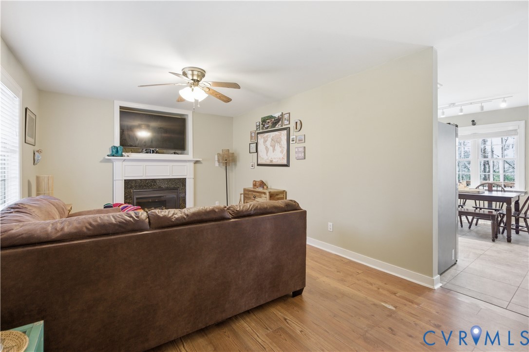 2949 Mountclair Road Chester, VA 23831 - Photo 4 of 30 Family room with gas fireplace and ceiling fan.