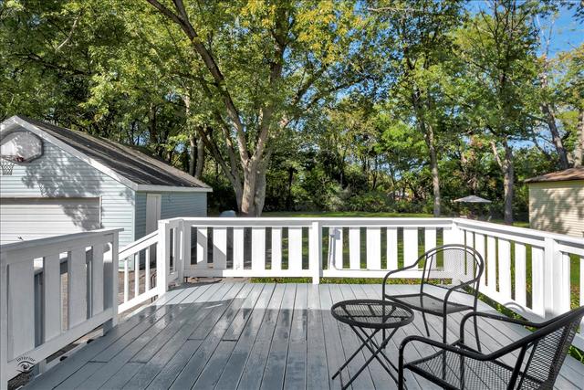 18424 Riegel Road Homewood, IL 60430 - Photo 5 of 25 a view of a chair and table on the wooden deck