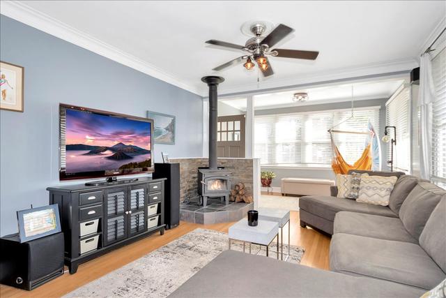 18424 Riegel Road Homewood, IL 60430 - Photo 8 of 25 a living room with furniture and a flat screen tv