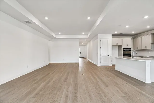 a view of kitchen with wooden floor