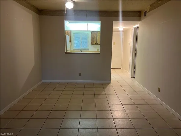 a view of an empty room and window