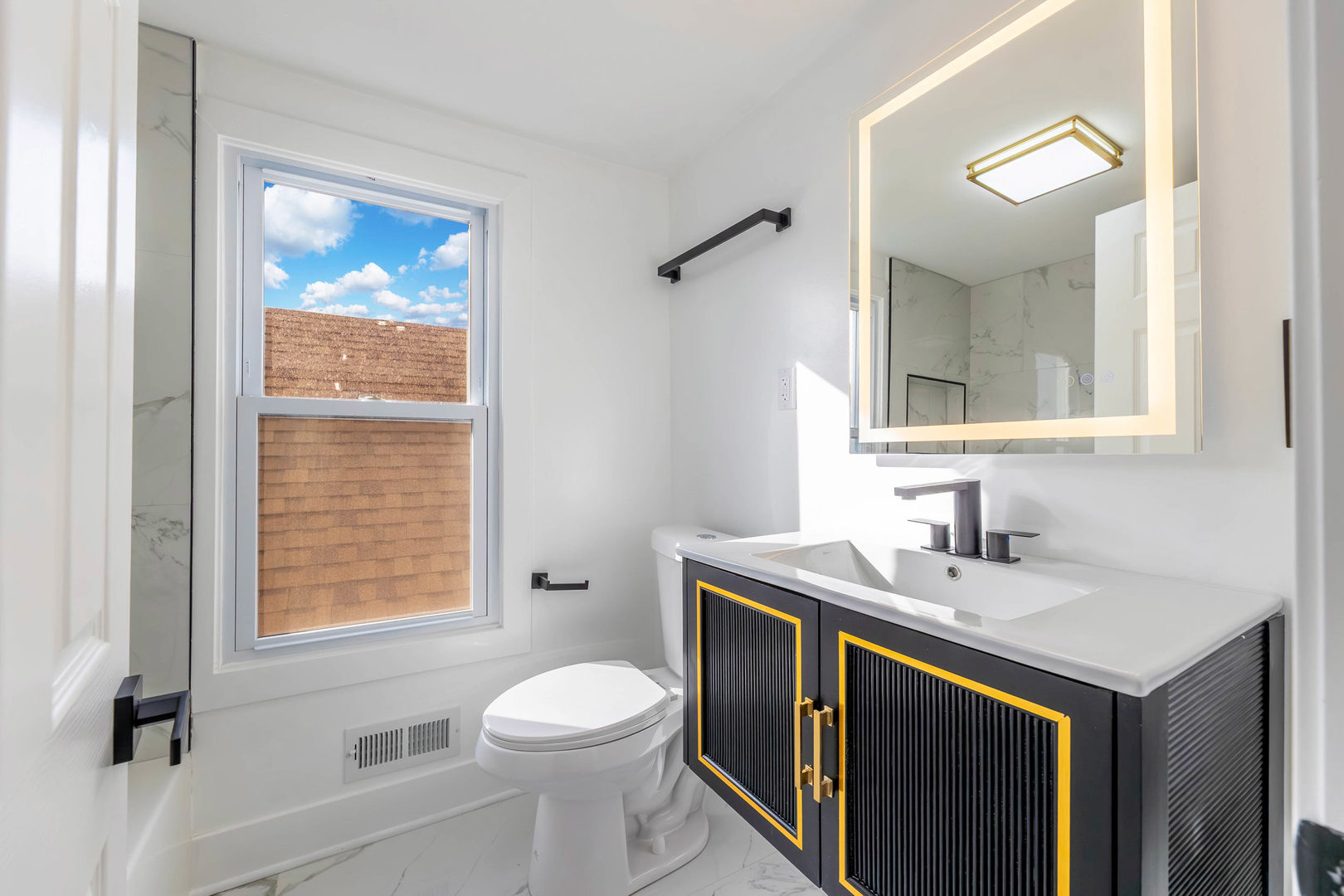 6742 South Carpenter Street Chicago, IL 60621 - Photo 16 of 36 a bathroom with a sink a toilet and mirror