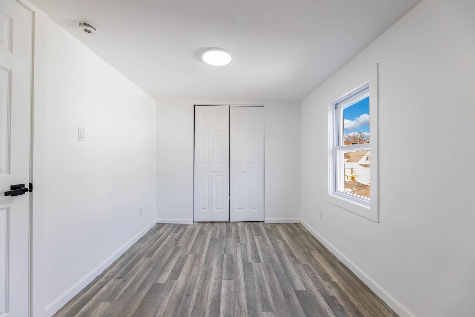 6742 South Carpenter Street Chicago, IL 60621 - Photo 20 of 36 a view of room with window and hardwood floor