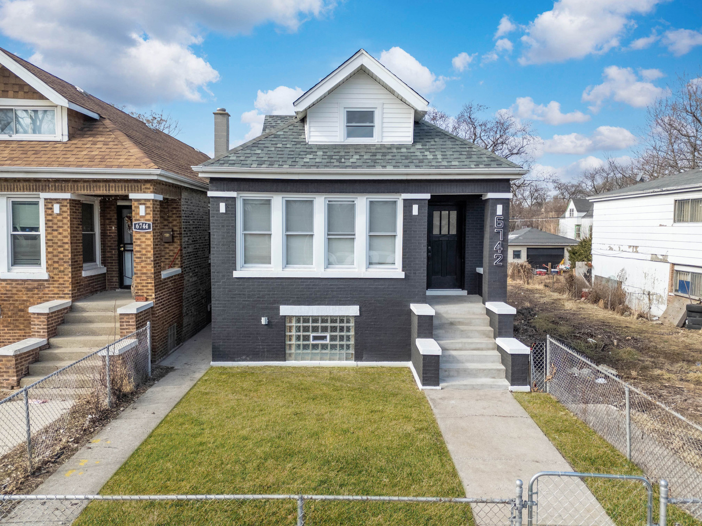6742 South Carpenter Street Chicago, IL 60621 - Photo 2 of 36 a front view of a house with a yard