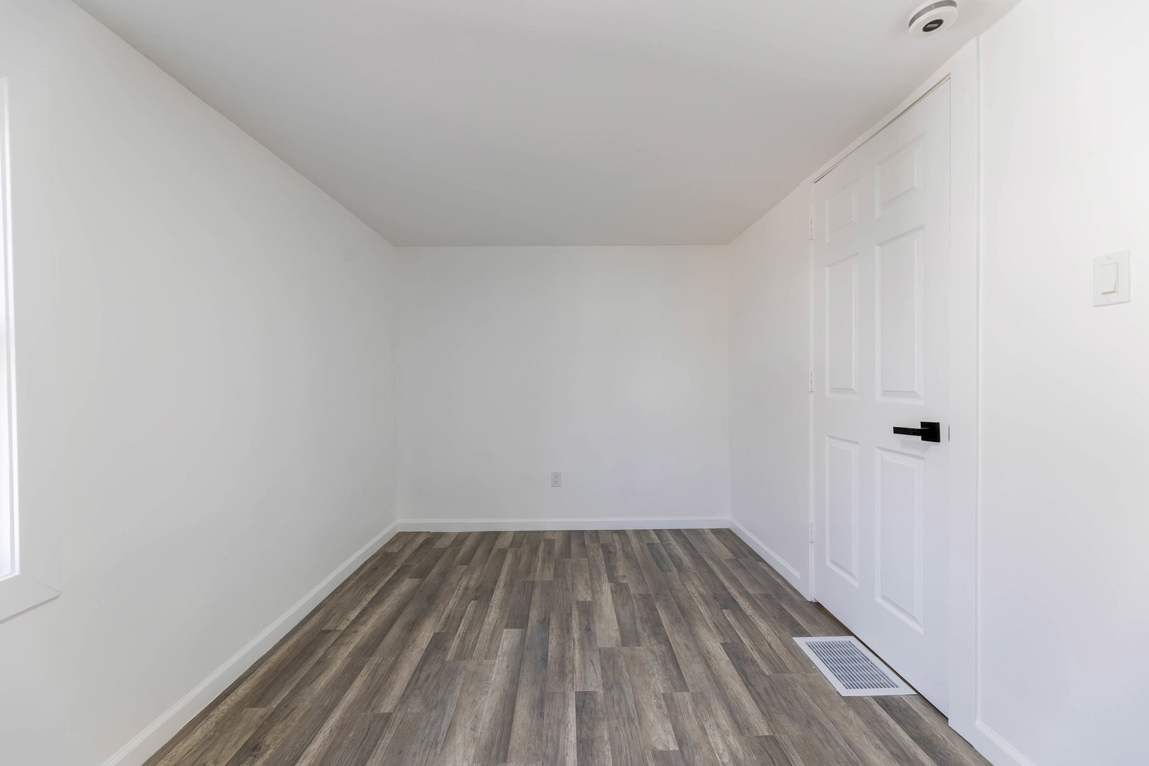 6742 South Carpenter Street Chicago, IL 60621 - Photo 21 of 36 a view of a room with wooden floor