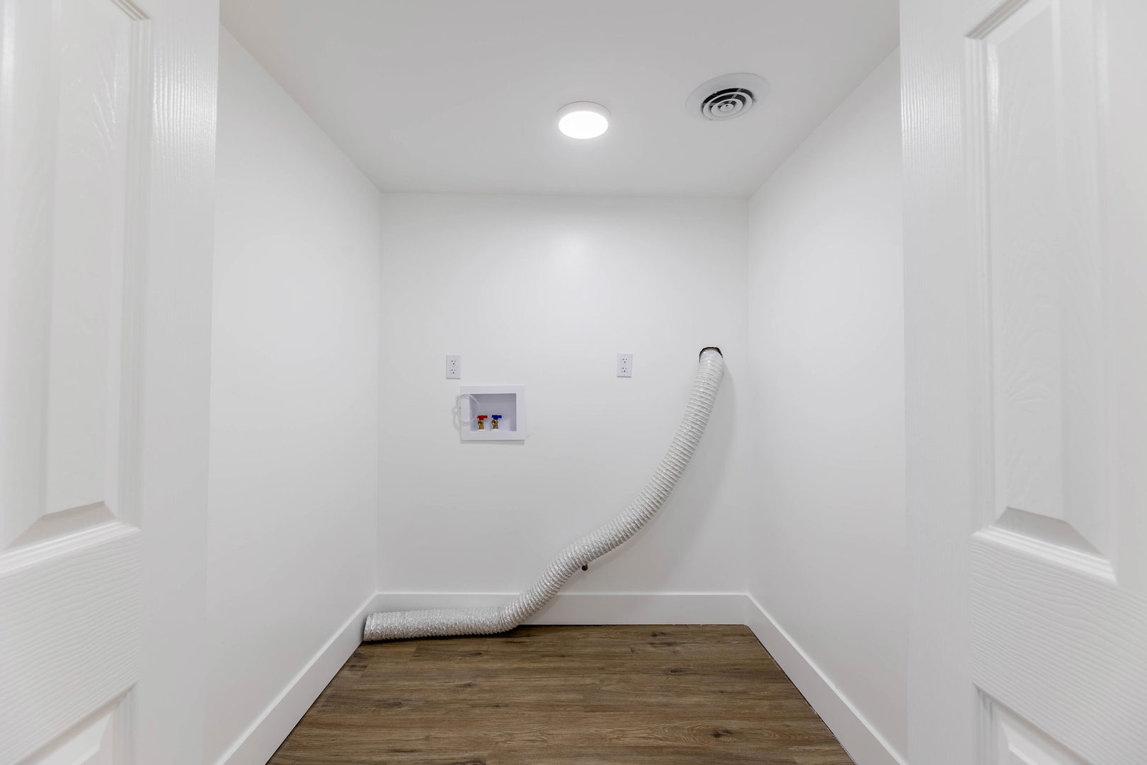6742 South Carpenter Street Chicago, IL 60621 - Photo 28 of 36 a view of a room with wooden floor and white walls