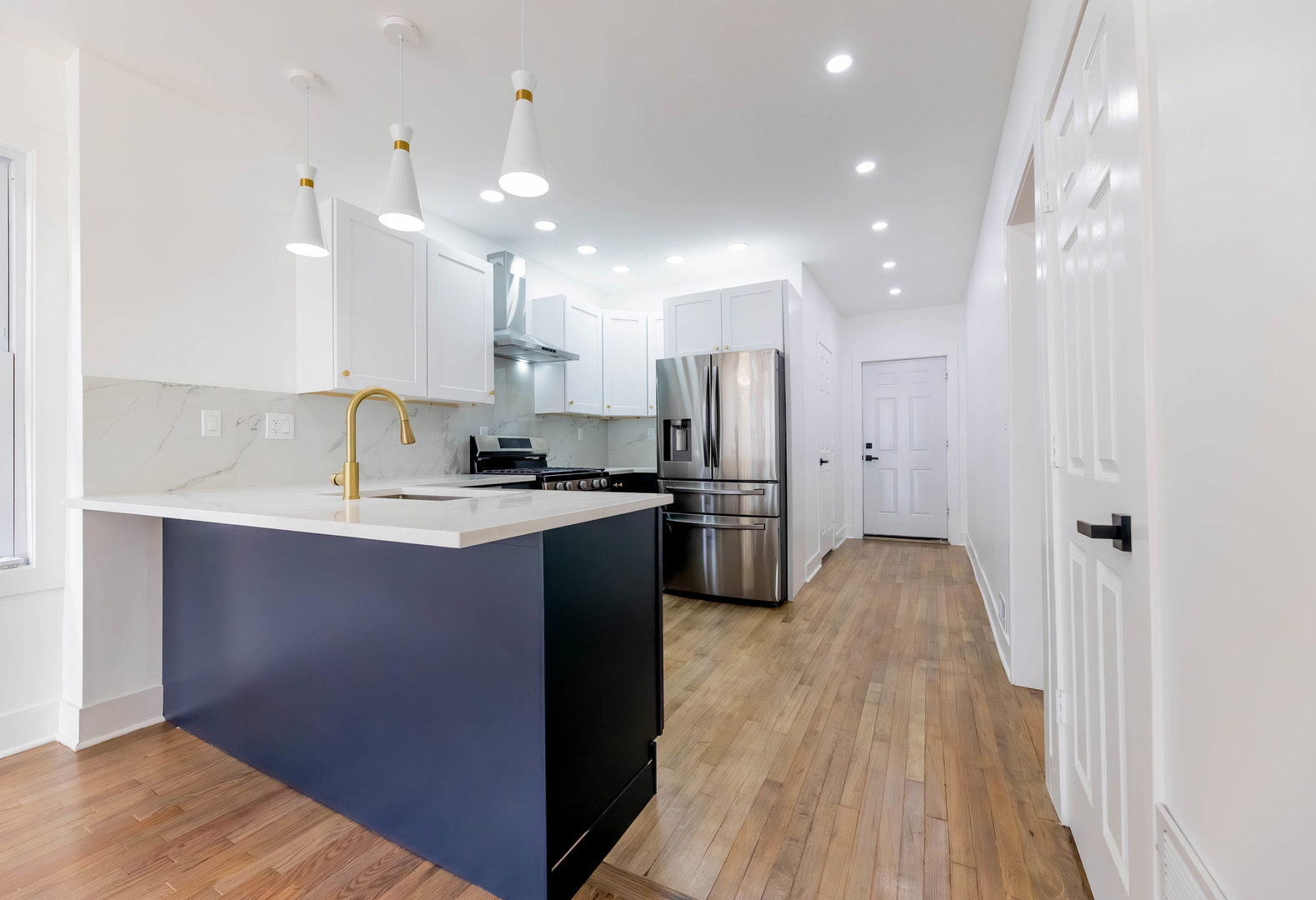 6742 South Carpenter Street Chicago, IL 60621 - Photo 7 of 36 a kitchen with kitchen island a sink stainless steel appliances and cabinets