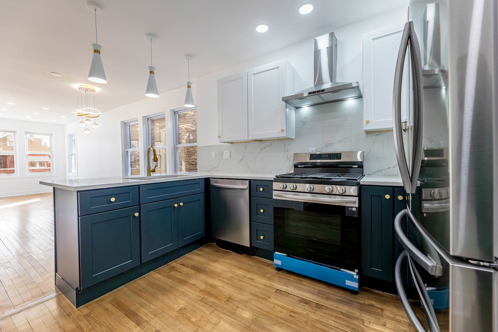 6742 South Carpenter Street Chicago, IL 60621 - Photo 8 of 36 a kitchen with stainless steel appliances granite countertop a refrigerator a sink dishwasher a stove and a refrigerator