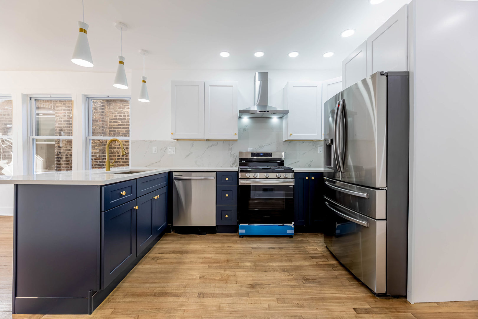 6742 South Carpenter Street Chicago, IL 60621 - Photo 9 of 36 a kitchen with stainless steel appliances granite countertop a refrigerator and a stove top oven