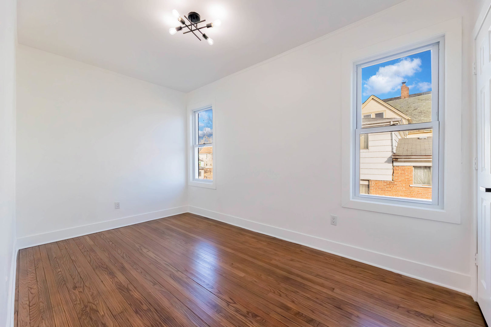 6742 South Carpenter Street Chicago, IL 60621 - Photo 10 of 36 an empty room with a workspace and a window