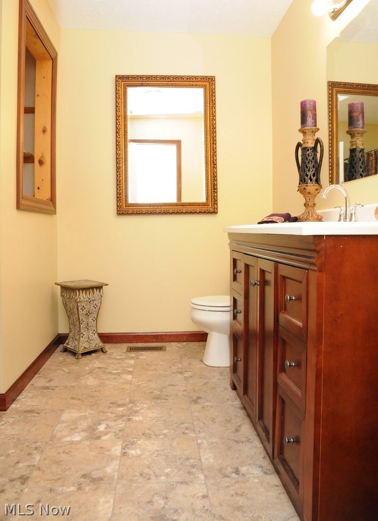 2895 Best Road Cambridge, OH 43725 - Photo 21 of 27 Main bath has new flooring, vanity, and fixtures