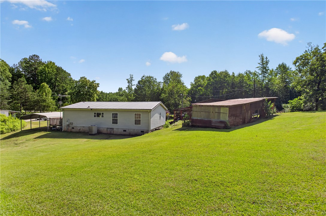 418 Chauga Road Westminster, SC 29693 - Photo 26 of 38 A spacious yard surrounds this cozy home, offering ample outdoor living space.
