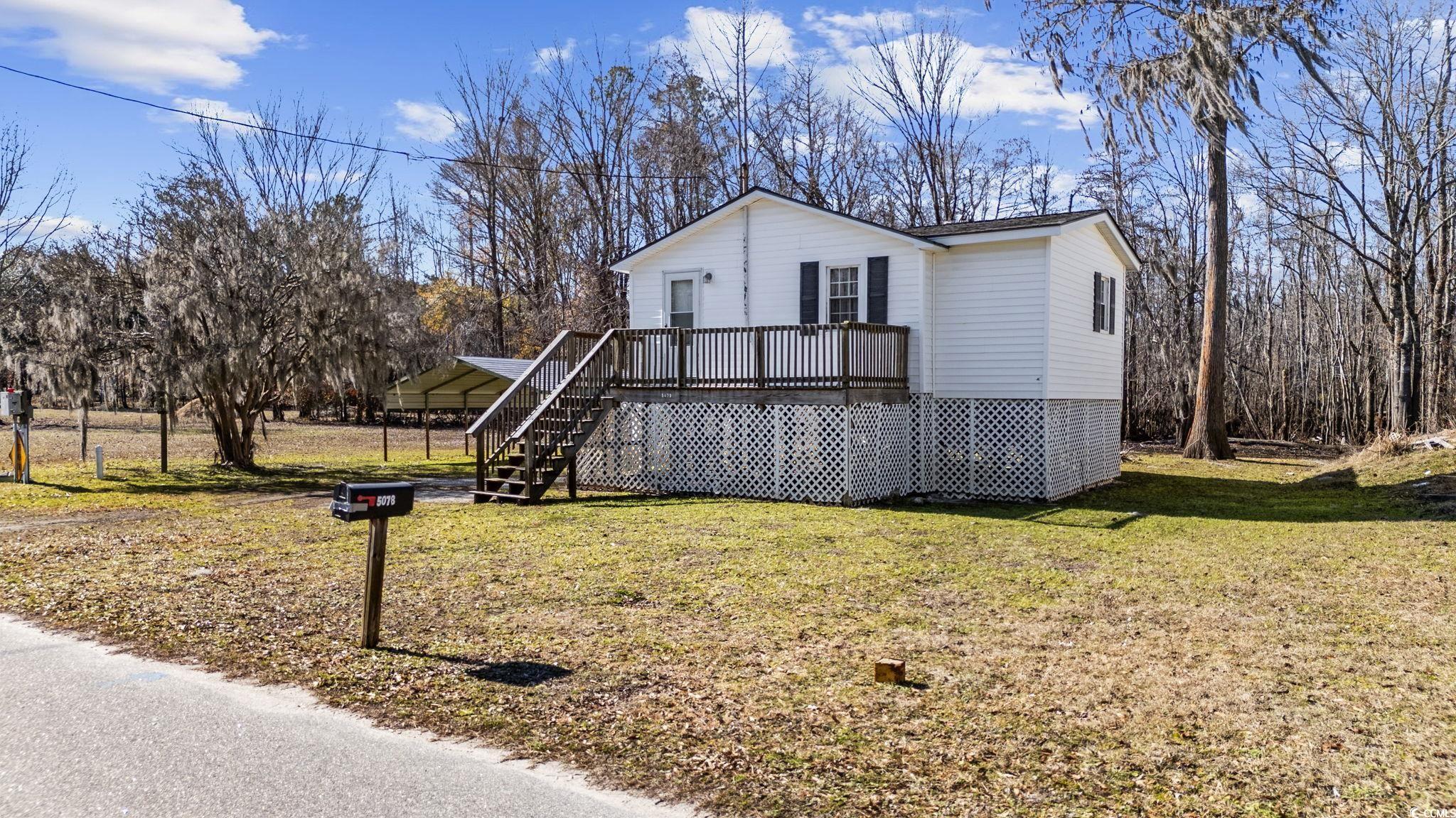 5078 Pitch Landing Road Conway, SC 29527 - Photo 1 of 31 View of front of house featuring a carport, a wood