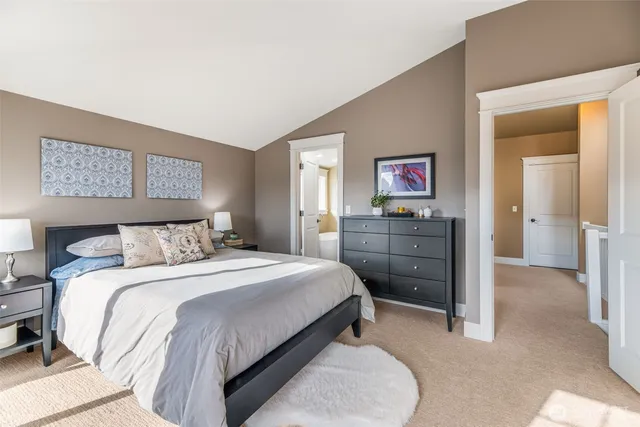 a bedroom with a bed and a cabinets