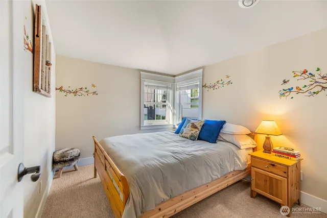 a bedroom with a bed and a chair