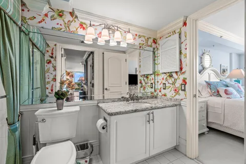 a bathroom with a sink a vanity and a mirror