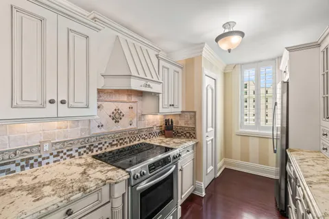 a kitchen with a stove and a refrigerator