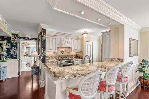 a kitchen with stainless steel appliances granite countertop a sink and cabinets